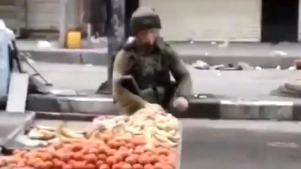 Un  comandante  dell'esercito israeliano ha runbato le mele di un venditore palestinese.