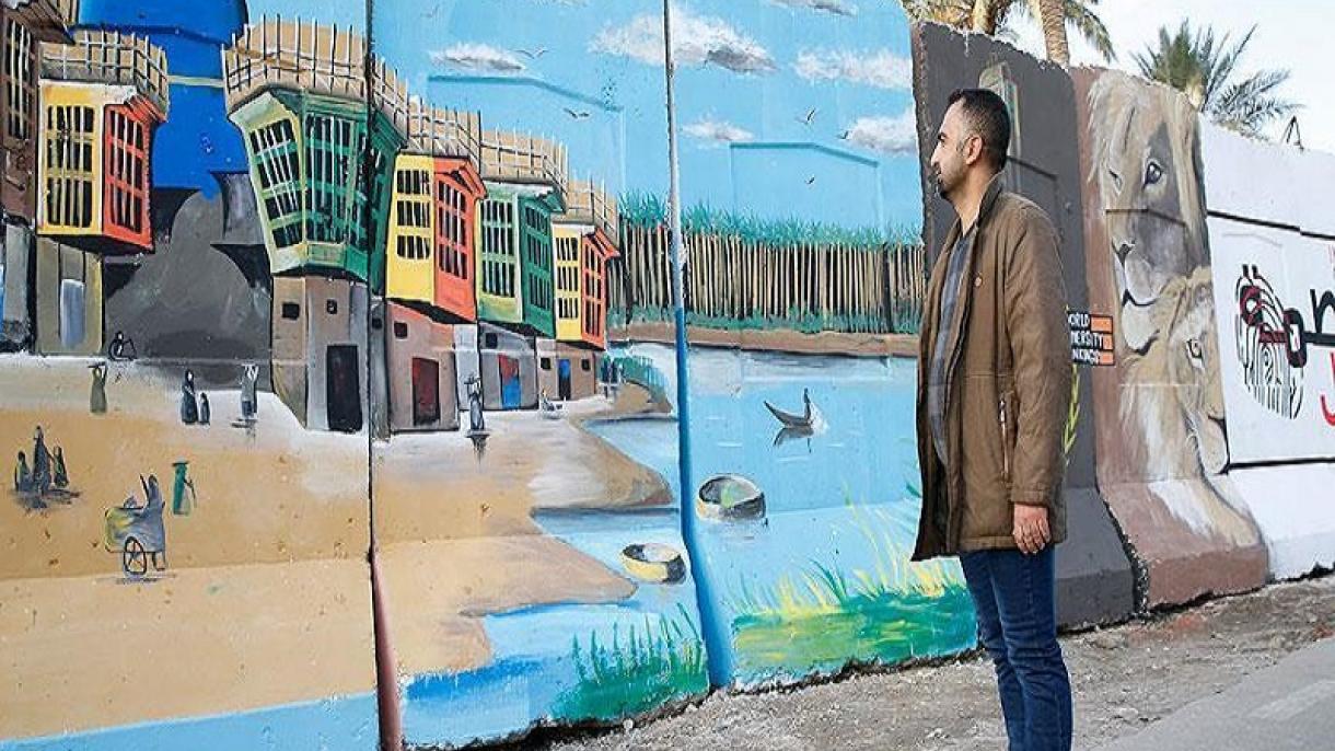 رنگ امید، صلح و زندگی بر روی دیوار های بتنی بغداد نقش می بندد