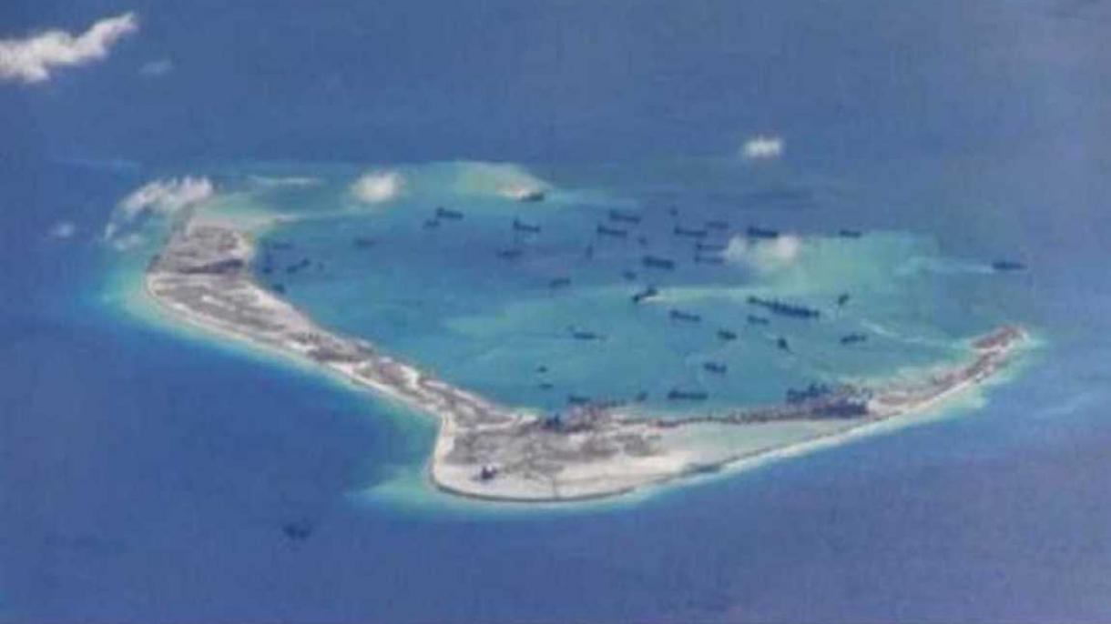 Un navire américain défi Pékin en passant près d’une île artificielle en Mer de Chine méridionale