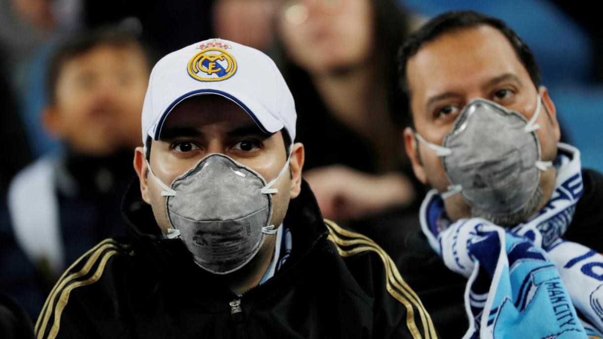 Real Madrid fans wearing face masks coronavirus.JPG
